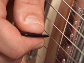 How to play pinch harmonics